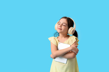 Sticker - Little girl with tablet computer and headphones on color background