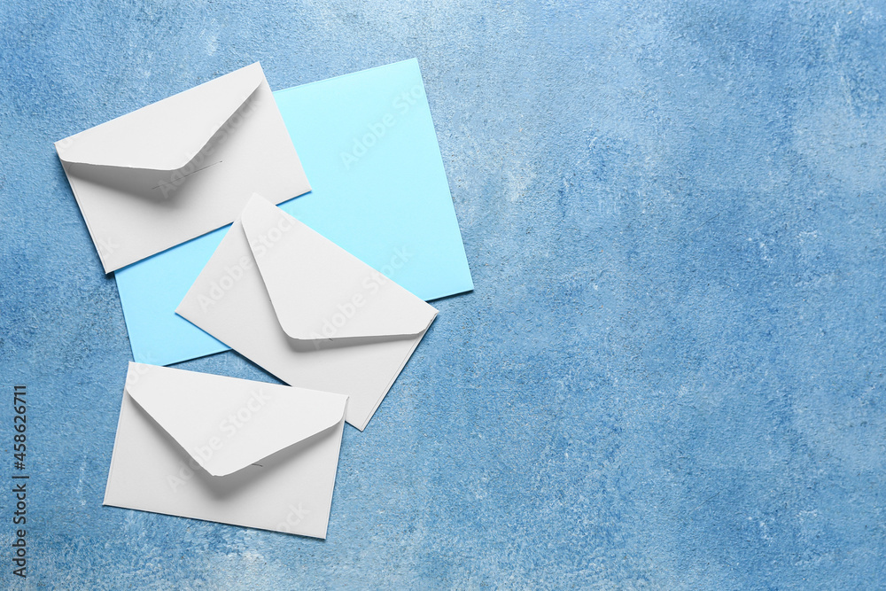 Blank card with envelopes on blue background