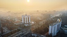 Aerial Drone View Of Chisinau Downtown. Panorama View Of Multiple Buildings, Parliament, Presidency, Roads With Moving Cars And Bare Trees. Fog. Moldova