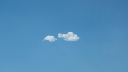 Wall Mural - only two clouds in a blue sky. great for background