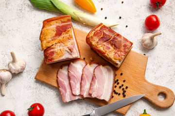 Wall Mural - Wooden board with tasty smoked bacon and fresh vegetables on light background