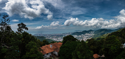 Poster - Aerial shot of a house on the mountain overlooking the city