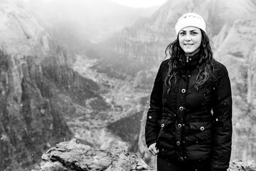 Portrait of a woman on top of a mountain in the winter - Black and white