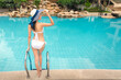 Young asian woman relaxing in swimming pool at spa resort.relaxing concept.