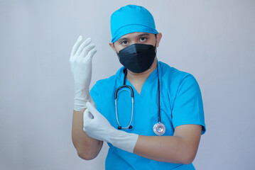 portrait of asian doctor wearing gloves