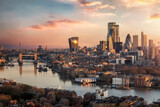 Fototapeta Londyn - The skyline of London city with Tower Bridge and financial district skyscrapers during sunrise, England, United Kingdom