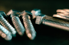 Pile Of Screws On A Black Background
