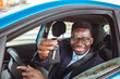 © Dragana Gordic - Closeup portrait happy, smiling, young man, buyer sitting in his new blue car showing keys isolated outside dealer, dealership lot. Personal transportation, auto purchase concept