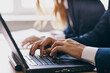 © SHOTPRIME STUDIO - colleagues sitting in front of a laptop teamwork internet officials