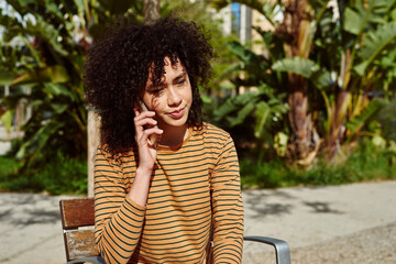 Poster - Cute young woman making a call outdoors