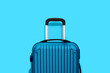 blue suitcasei isolated on blue background