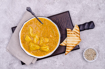 Wall Mural - Curry with vegetables, lentils and meat