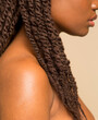 © Phiwo Ndlovu/Cultura Creative - Close-up of woman with braided hair