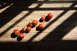 © olly_plu - Freshly harvested red cherry tomatoes on the wooden cutting board