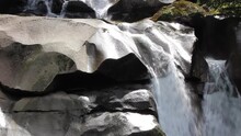 Rainforest Waterfall Erodes Stone Into Smooth Rock Sculpture Over Eons