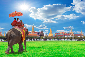 Elephant for tourists an ride tour of the grand architecture, a venue now mostly used for ceremonial events. The Buddhist temple of Wat Phra Kaeo at the Grand Palace in Bangkok, Thailand