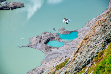 Poster - Amazing lake colors under a glacier in the Alps, summer season.