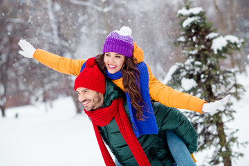 Sticker - Photo of funky sweet marriage couple wear windbreakers cuddling smiling having fun walking snowy weather outside park