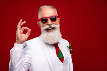 Poster - Photo of happy charming positive man make okay sign recommend wear sunglass isolated on red color background