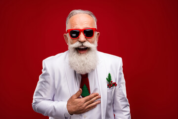 Wall Mural - Photo of old happy positive old man wear three piece suit good mood laugh joke isolated on red color background