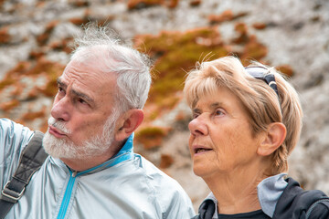 Sticker - Elderly retired couple relaxing in the middle of a mountain trip.