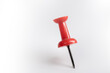 © Isaac - Red pin isolated on white background.