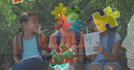 Canvas Print - Animation of colourful puzzle pieces over school children using tablets