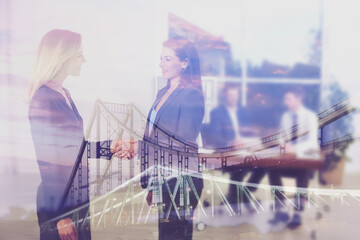 Poster - Double exposure of bridge and businesswomen shaking hands in office