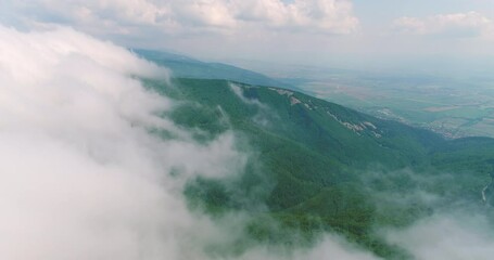 Wall Mural - aerial sky view of mountains landscape. forest, peaks and clouds.