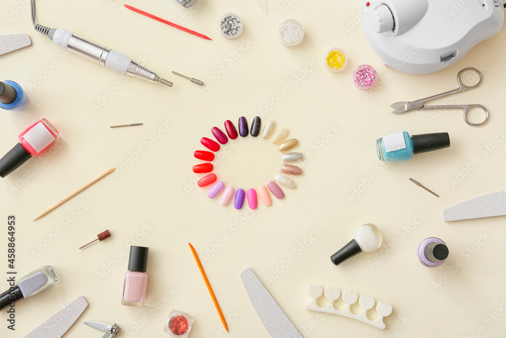Set of tools for manicure on color background