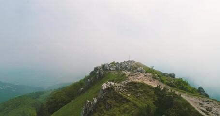 Wall Mural - flying above mountain hills and fog. mountains landscape aerial view.