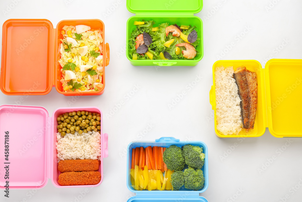 Many plastic containers with delicious food isolated on white, closeup