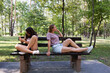 © hannamartysheva - Mom and teenage daughter use a smartphone for a walk in a summer park