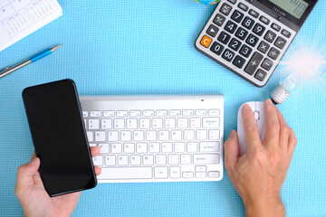 Poster - Businessman types on a computer keyboard at a wooden desk. Banking and strategy development A financial analyst is at work in the workplace. 