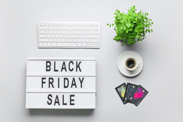 Poster - Board with text BLACK FRIDAY SALE, credit cards, PC keyboard and coffee on light background