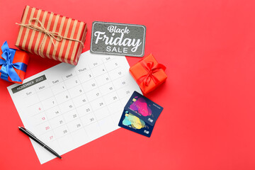 Poster - Calendar page of November 2022, credit cards and gifts on color background. Black Friday