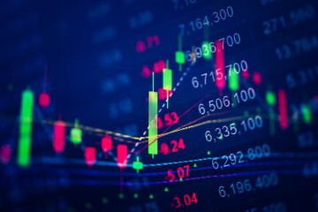 Abstract financial trading graphs and digital number of foreign exchange market trading on monitor. Background of gold and blue digital chart to represent stock market trend.