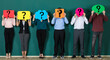 © Bangkok Click Studio - group of people holding speech bubble card with question mark sign in front of their faces. Standing isolated in front of green background