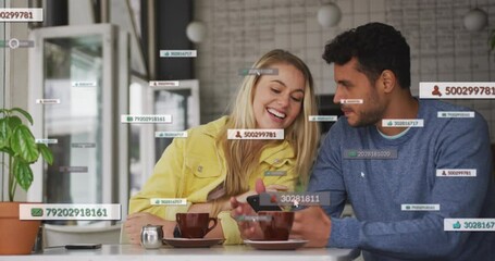 Poster - Animation of social media icons floating over happy caucasian couple using smartphone having coffee