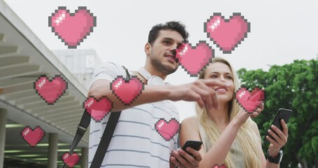 Poster - Animation of heart icons floating over happy caucasian couple talking and using smartphone