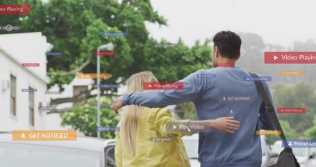 Poster - Animation of social media icons floating over happy caucasian couple walking and embracing