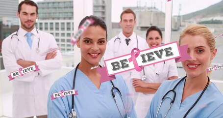 Wall Mural - Animation of pink breast cancer ribbons over group of smiling doctors