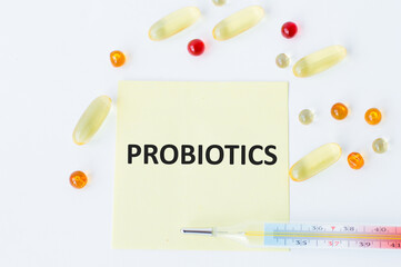 Wall Mural - On the card is the inscription PROBIOTICS, around there are blisters with tablets and a thermometer