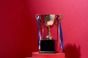 Close up classic trophy on the red background