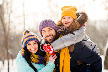 Poster - Photo of attractive family happy positive smile daughter piggyback parents happy positive smile outdoors