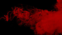 Drops Of Red Ink In Water. Cosmic Star Background. Red Watercolor Paints In Water On A Black Background. Beautiful Wallpaper For Your Desktop. Red Cloud Of Ink.