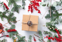 Christmas Decorations On A White Background,and A Gift Wrapped Present