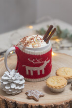Christmas, A Mug Of Hot Chocolate Or Eggnog With A Knitted Wraparound Cosy And Mince Pies.