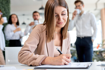 Nice business lady signing financial contract, put write signature on legal corporate paper fill document form buy insurance loan, making business agreement, close up view. business concept