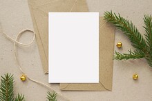 Christmas Greeting Card Mockup, Blank Vertical Notecard, Postcard, Craft Paper Envelopes, Fir Tree Branches.